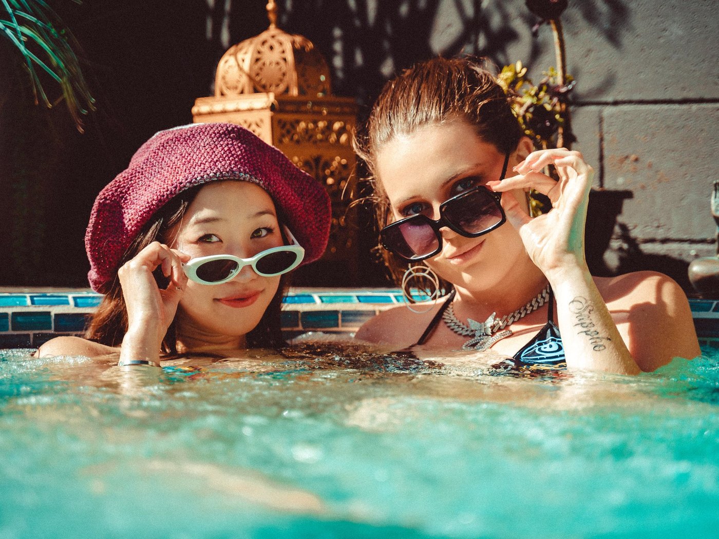 Friends relaxing in an outdoor hot tub